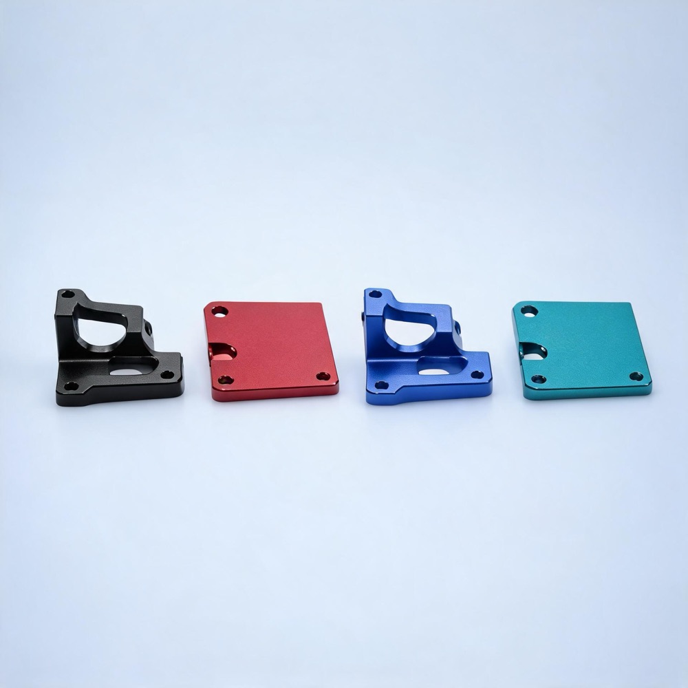 Anodized aluminum parts in black, red, blue, and teal