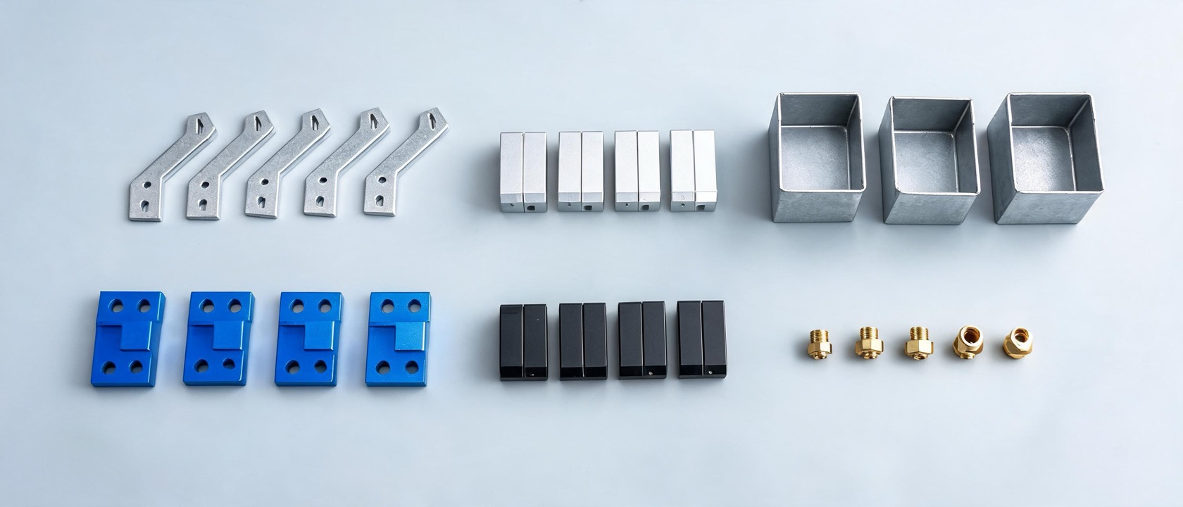 Dozens of finished custom parts: laser-cut brackets, machined blocks, bent enclosures, anodized pieces
